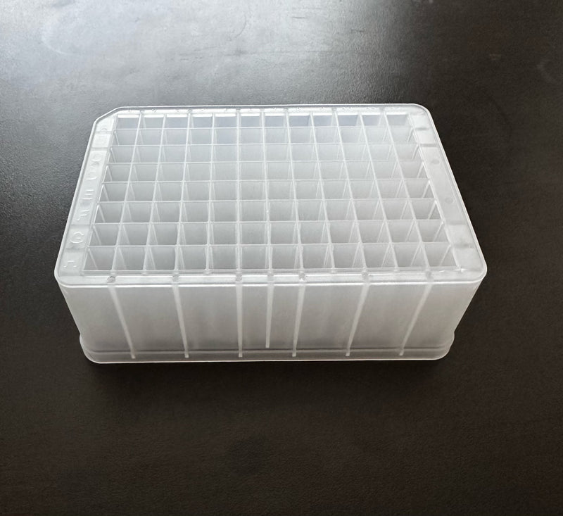 A clear polypropylene deep well plate with alphanumeric well codes, designed for laboratory use.