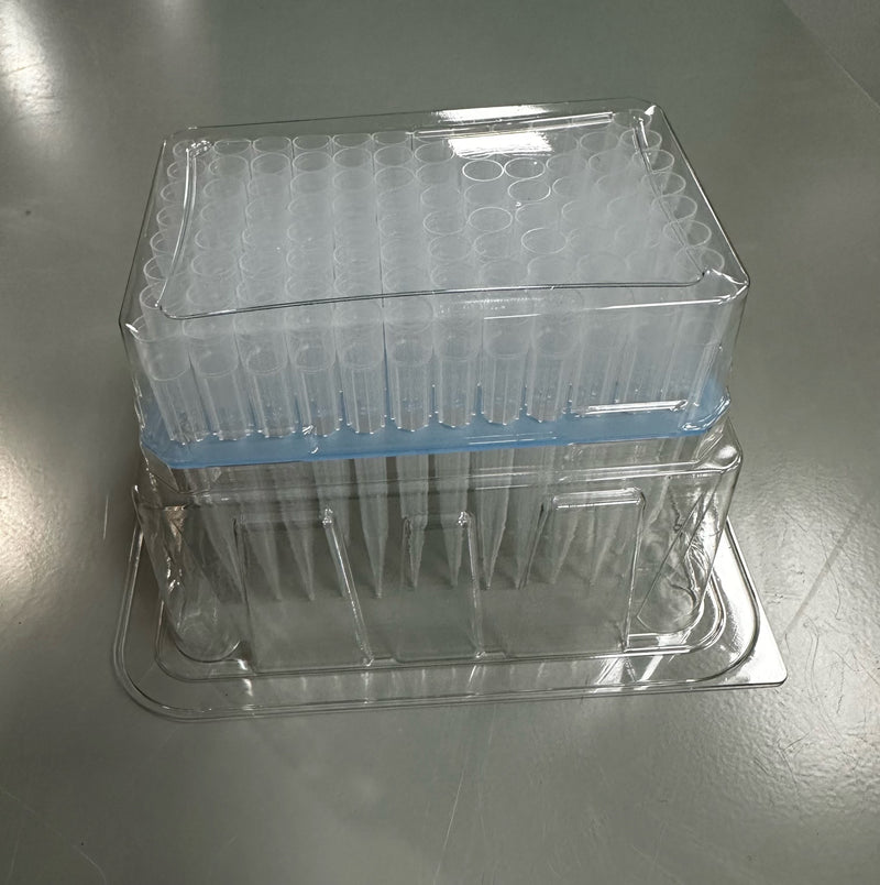 Case of pipette tips made from translucent plastic and sealed in a clear plastic 